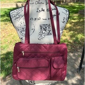 Burgundy shoulder strap purse. It comes with a coin purse, and glasses case.